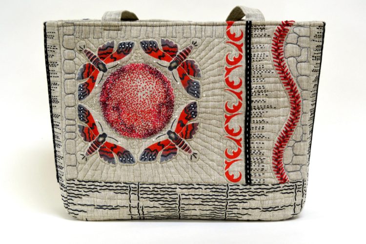 April Sproule, Red Moths Art Tech Satchel, 2016. 38cm x 30cm x 8cm (15” x 12” x 4”). Stencilling, hand embroidery, free-motion quilting. Linen, textile paints, cotton floss, original stencils.