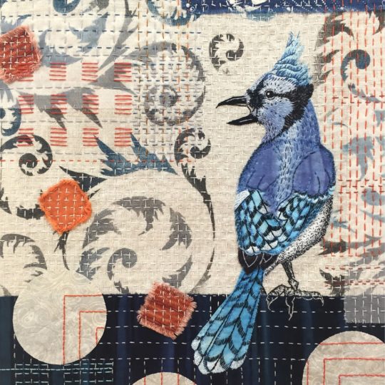 April Sproule, Mr. Blue, 2021. 36cm x 46cm (14” x 18”). Hand appliqué, hand embroidery, stencilling. Linen, silk, cotton, textile paints, handmade paper from Nepal.