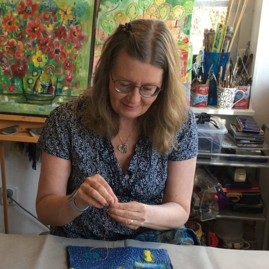 Heléne Forsberg stitching in her studio.