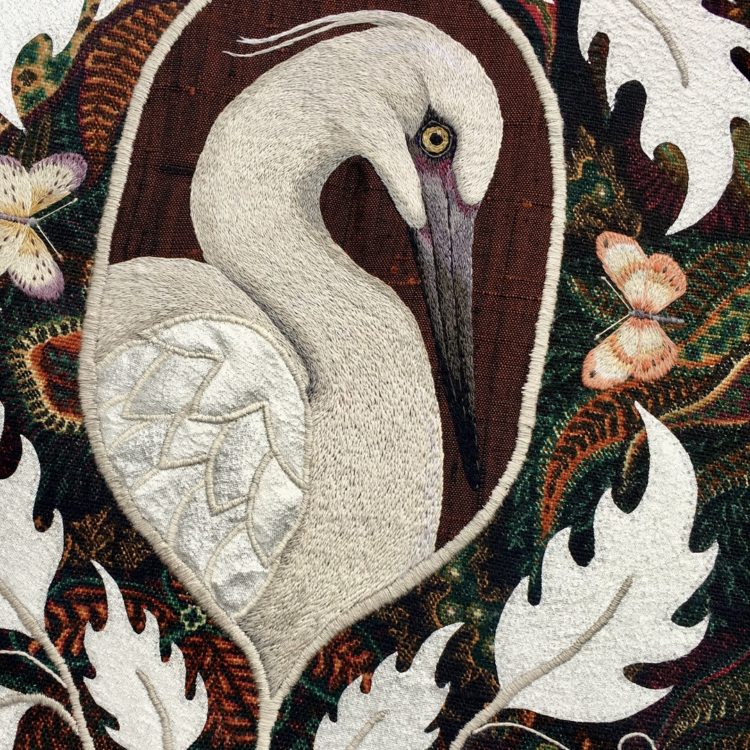 Yvette Phillips, Little Egret (detail), 2021. 30cm x 40cm (12" x 15¾"). Hand embroidery and appliqué. Vintage Liberty fabric and vintage silver lamé.