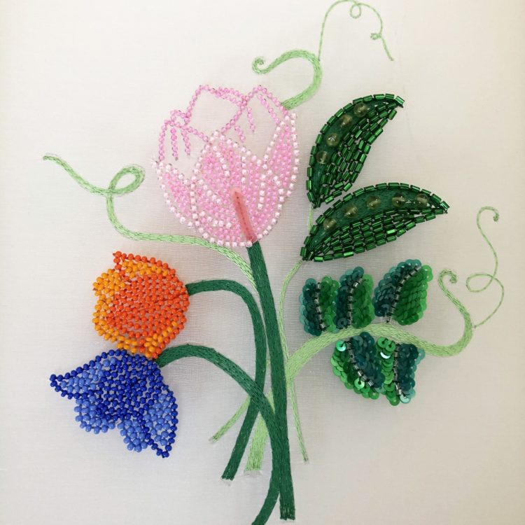 Hannah Mansfield, Beaded Flowers and Peas, 2020. 17cm x 15cm (6 ¾” x 6”). Tambour beading. Fil a gant thread, beads, sequins.
