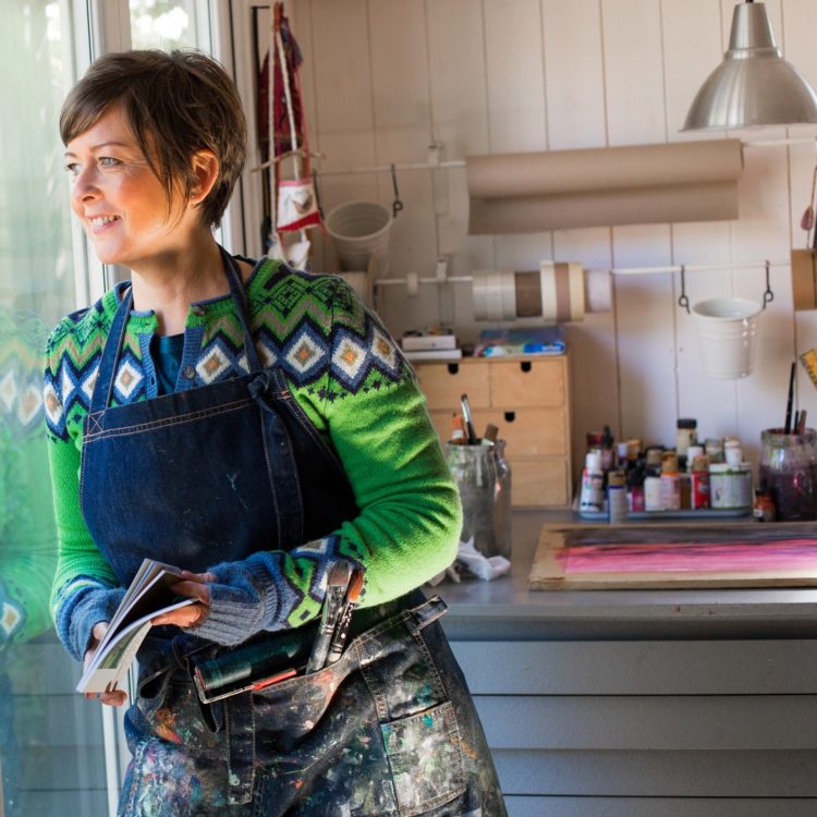 Helen Hallows looking out from her studio at her allotment.