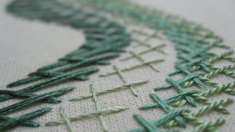 Tracy A Franklin, Green Herringbone Stitch Sampler (detail), 2012. Approximately 20cm x 20cm (8” x 8”). Herringbone stitch. A variety of threads and fibres worked on double calico. 