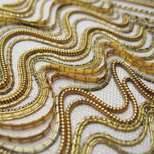 Tracy A Franklin, Linear Goldwork Sampler (detail), 2014. Approximately 15cm x 23cm (6’ x 9”). Goldwork couching. A variety of gold and metal threads worked on linen.
