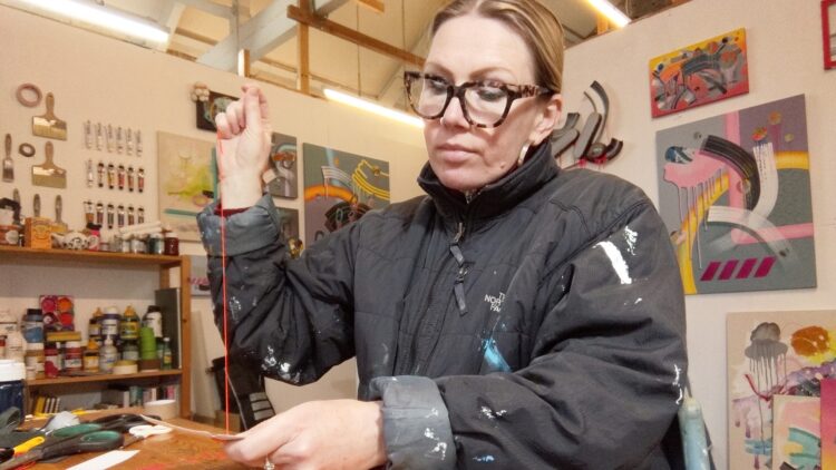 Sam Owen Hull stitching in her studio 