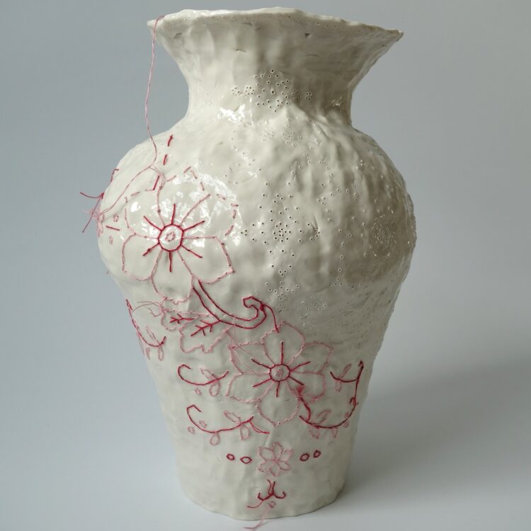 Caroline Harrius, Red Vase (work in progress), 2023. 25cm tall (10“). Coiled stoneware, embroidered with cotton thread. Stoneware, cotton thread.