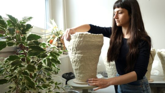 Caroline Harrius building a vase in her studio