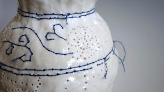 Caroline Harrius, Embroidered Vase, 2020. 40cm tall (15½“). Coiled porcelain, decorated with cotton thread. Porcelain, cotton thread.