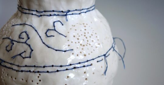 Caroline Harrius, Embroidered Vase, 2020. 40cm tall (15½“). Coiled porcelain, decorated with cotton thread. Porcelain, cotton thread.