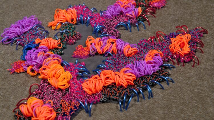 Elnaz Yazdani, Experimental Embroidery, 2018. 30cm x 40cm (12" x 16"). Embellishment, beading, seed stitch, French knots, laser cutting, couching. Rubber, plastic, form, silk, linen thread, metal.
