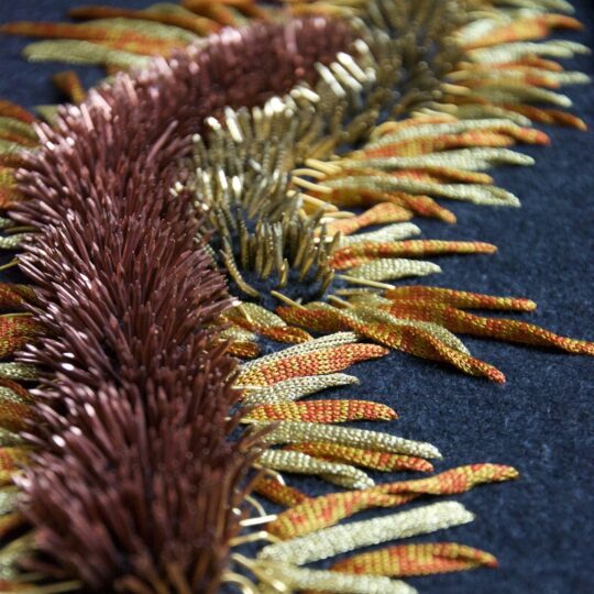 Elnaz Yazdani, Opulence, 2019. 60cm x 40cm (24" x 16"). Cut work, knitted yarn, beading, goldwork, embellishments. Yarns, purl wire, pins, metal, wool.