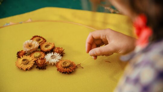 Elnaz Yazdani, Embroider with Nature, 2022. 50 x 50cm (20" x 20"). Goldwork, embellishments, beading. Wool, cornflowers, purl wire, beading thread. Photo: Bokehgo.