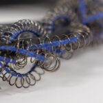 Elnaz Yazdani, Zardozi, 2019. 30 x 25cm (12" x 10"). Goldwork techniques. Bullion wire, springs, metal, rubber, linen thread.