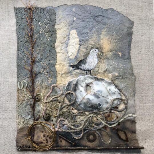 Lesley Wood, Kittiwake Flotsam, 2022. 47cm x 36cm (18½" x 14"). Hand embroidered mixed media collage. Linen, momigami paper, hand dyed lace, embroidery threads, fragments of assorted fabrics and threads, wire, metal objects, wood, shell.