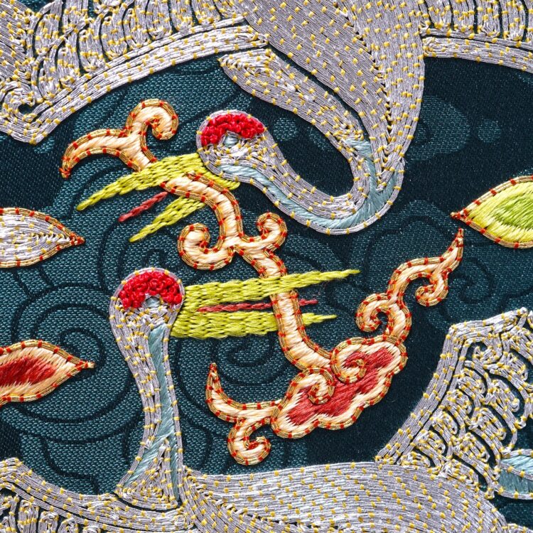 Heewha Jo, Hyungbae, rank insignia with two cranes (detail), 2021. 17cm x 20cm (6½" x 7¾"). Hand embroidery. Silver, gold and silk thread, silk satin.