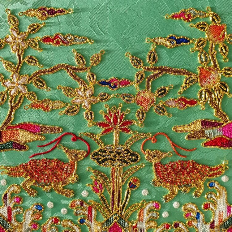 Heewha Jo, But-Jumeoni, brush pouch with longevity symbols (detail), 2021. 11cm x 31cm (4" x 12"). Hand embroidery. Silk and gold thread, silk satin.