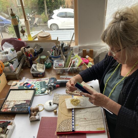 Louise Baldwin working in her studio.