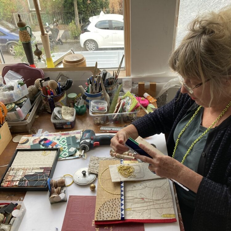 Louise Baldwin working in her studio.