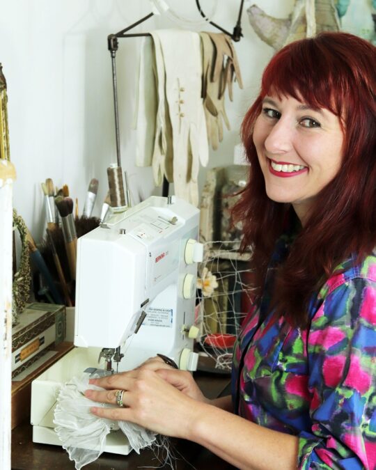 Priscilla Edwards working at the sewing machine in her studio. Photo: Prue Edwards.