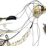 Priscilla Edwards, Bird in the Hand (detail), 2022. 37cm x 25cm (15" x 10"). Free machine embroidery, hand stitch, hand manipulated wire. Wire, leather, rayon thread, silk, porcelain, feathers, buttons, entomology pins, found materials.