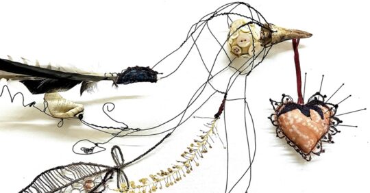 Priscilla Edwards, Bird in the Hand (detail), 2022. 37cm x 25cm (15" x 10"). Free machine embroidery, hand stitch, hand manipulated wire. Wire, leather, rayon thread, silk, porcelain, feathers, buttons, entomology pins, found materials.