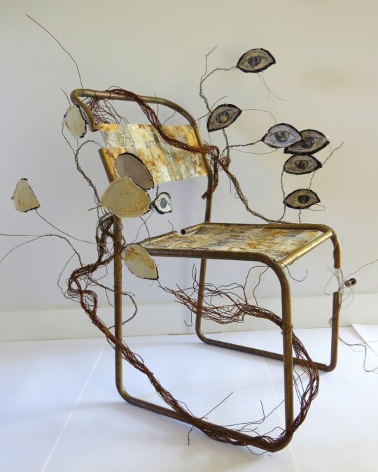 Krystyna Pomeroy and Rachael Singleton, Please Be Seated, 2019. Metal chair frame covered with paper, wire, distressed and rusted silk and cotton, vintage photograph negatives.