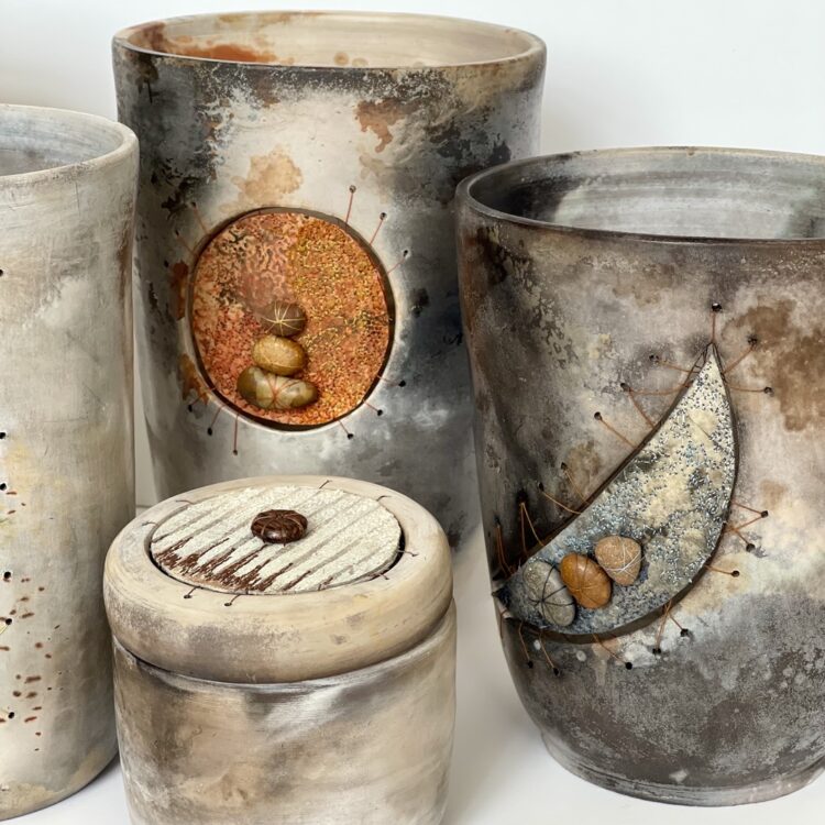 Martine Becquet and Rachael Singleton, Group of Smoke Fired Pots, 2020. Various sizes. Smoke fired clay, machine stitching, free machine embroidery. Decovil 1 interfacing, teabag paper, bonded paper, pebbles.