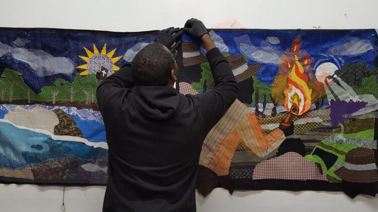 Stephen Towns working on the Nat Turner quilts in his studio.