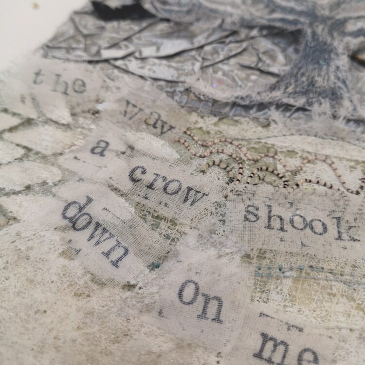 Angie Hughes, Crow in the Snow (work in progress), 2024. 30cm x 15cm (12" x 6"). Machine embroidery, mixed media collage. Paper, net, heated organza, tissue paper, Lutradur, pelmet interfacing.