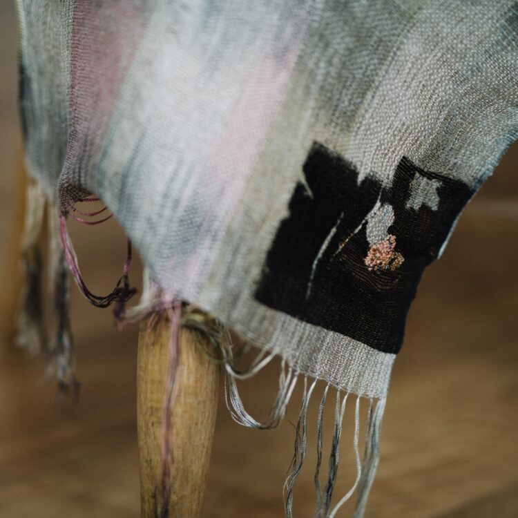 Kate Whitehead, Honesty Three - Honesty is the Best Policy Series, 2019. 45cm x 100cm (17½" x 39½"). Salvaged grey linen: pink silk warp; gold, orange, pink and black silk weft, black honesty printed square, terracotta embroidery thread. Hand weave. Photo: Sarah Mason Photography.