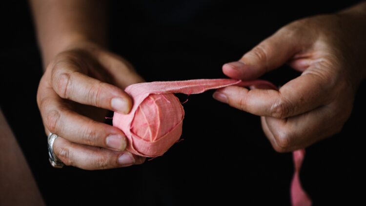 Kate Whitehead, pink dyed ribbon used in hand weave, 2019. Dye. Cotton ribbon. Photo: Sarah Mason Photography.