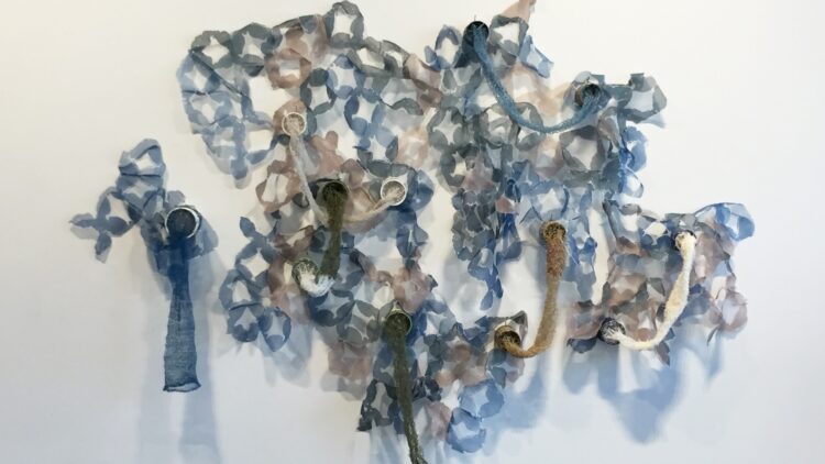 Amanda Britton, Johanna Norry and Ester Mech, Undermined installation at the University of Georgia, 2017. 3m x 3m (10' x 10'). Knitting, assemblage, ceramics, screen printing. Ceramics, cotton, silk organza.