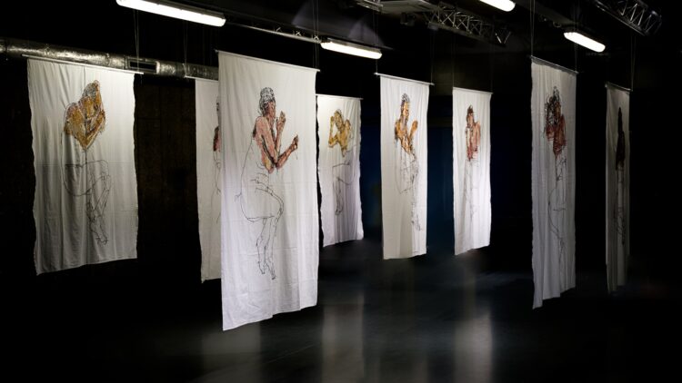 Ewa Cieniak, Wake Up Humans, 2023. Installation of eight sheets. Each 2.2m x 1.5m (7ft x 5ft). Hand embroidery. Repurposed cotton sheets, cotton thread. 