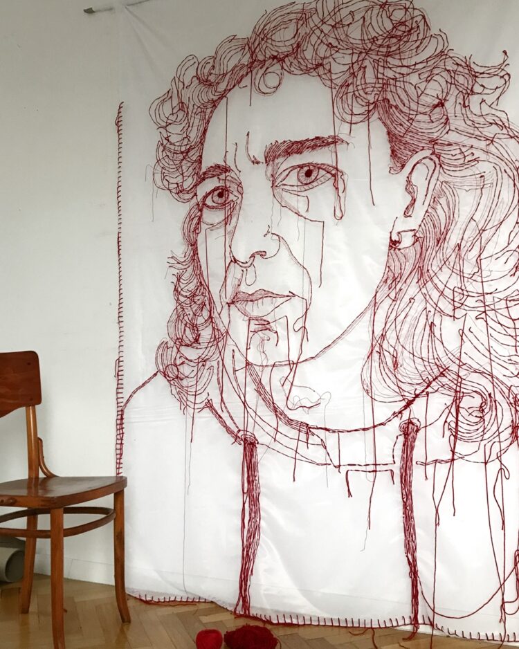 Ewa Cieniak, Red Thread, 2024. One of seven portraits, each 3m x 1.8m (10ft x 6ft). Hand embroidery. Red yarn, repurposed curtain.