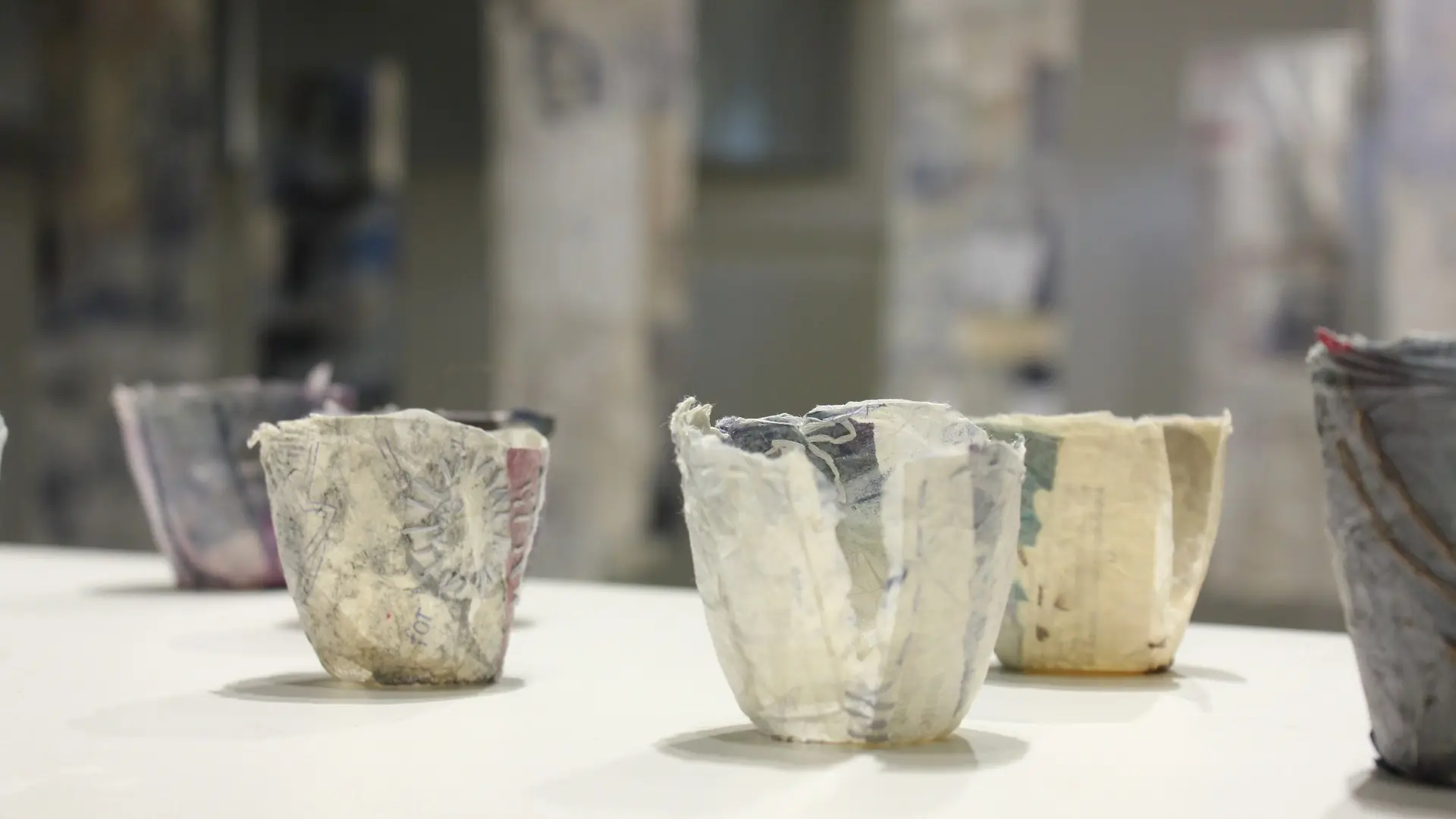 Textile sculptures of cup like vessels
