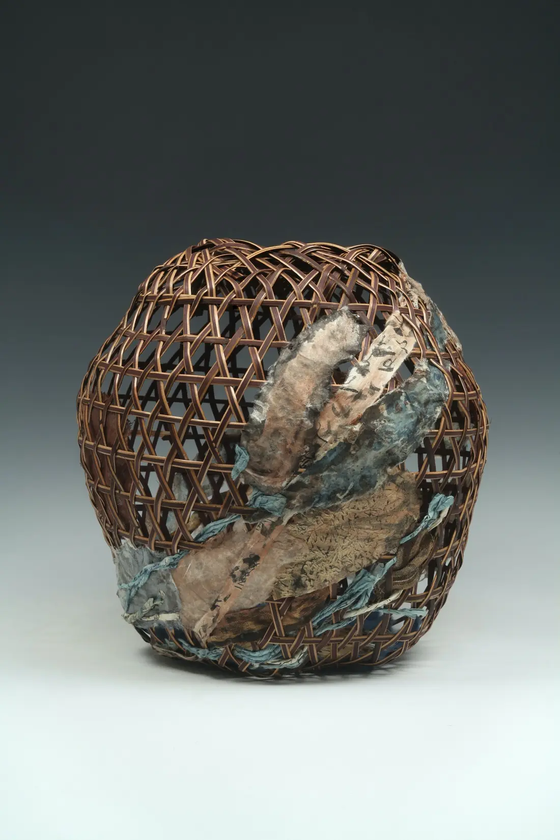 Barbara Shapiro: Troubled Waters, Inside detail, 2019, 13 x 13 x 13”, Plaited sedori cane, paper, cloth, indigo, sumi ink. Photo credit, Don Felton