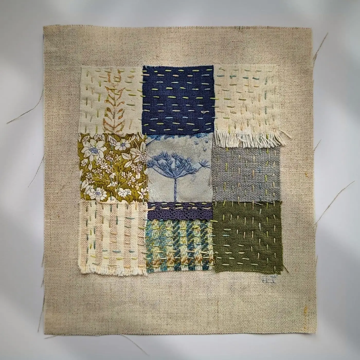 A square stitched textile sample
