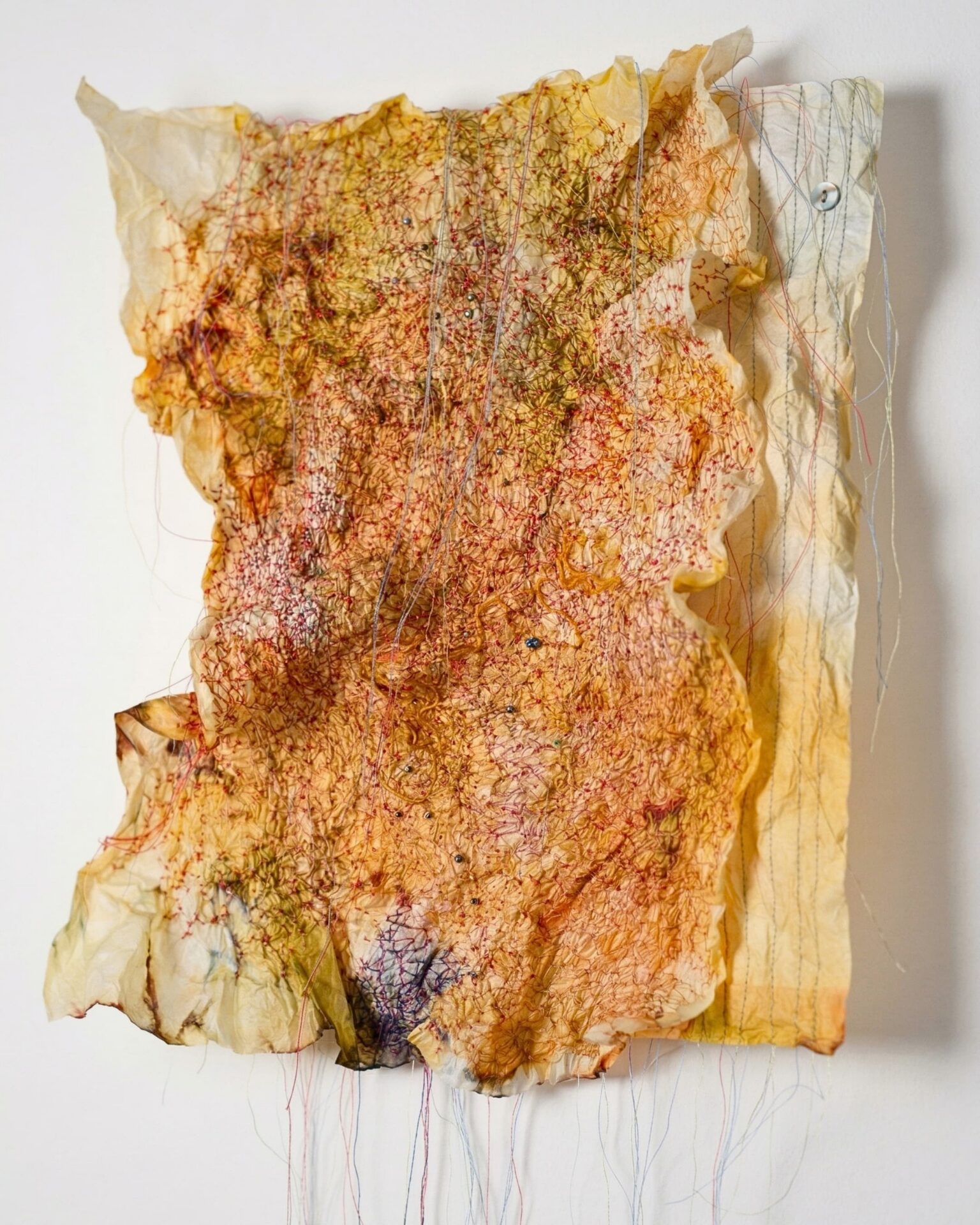 Textured abstract artwork with vibrant colours.