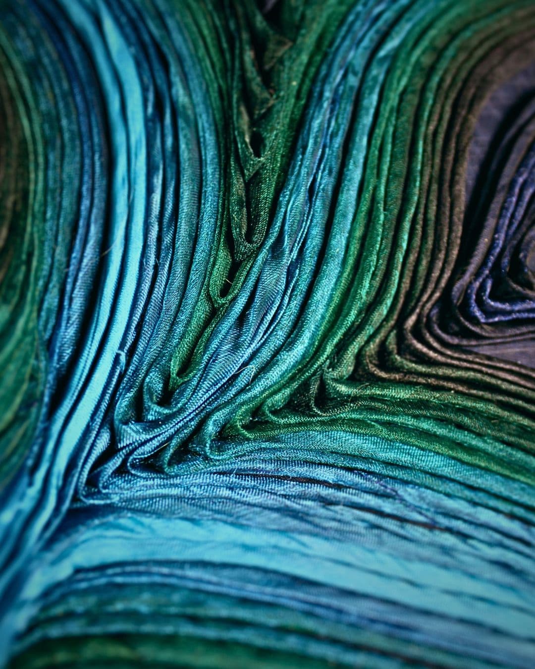 Close up textile artwork with textured fabric of the sea.