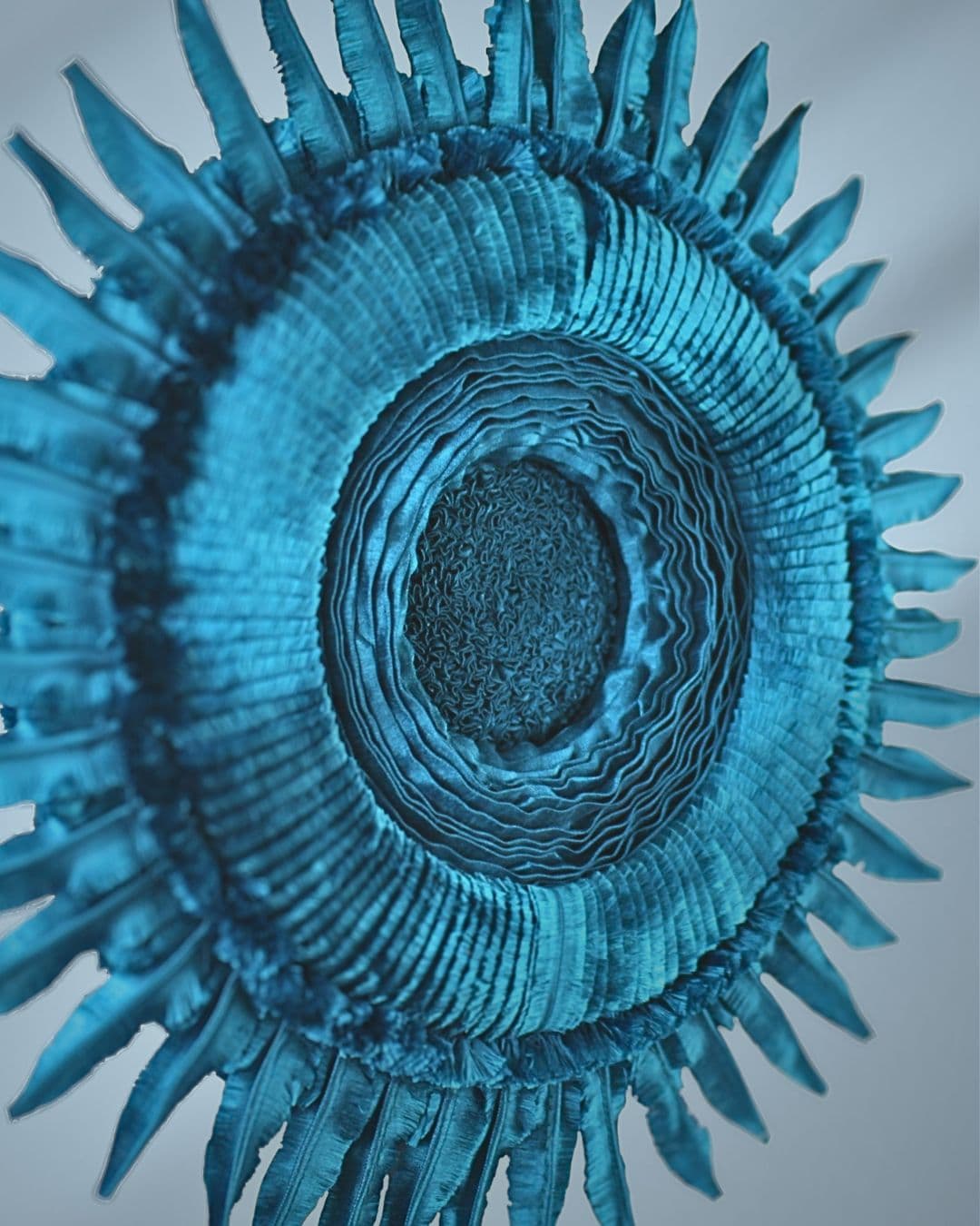 Textured blue circular textile wall art