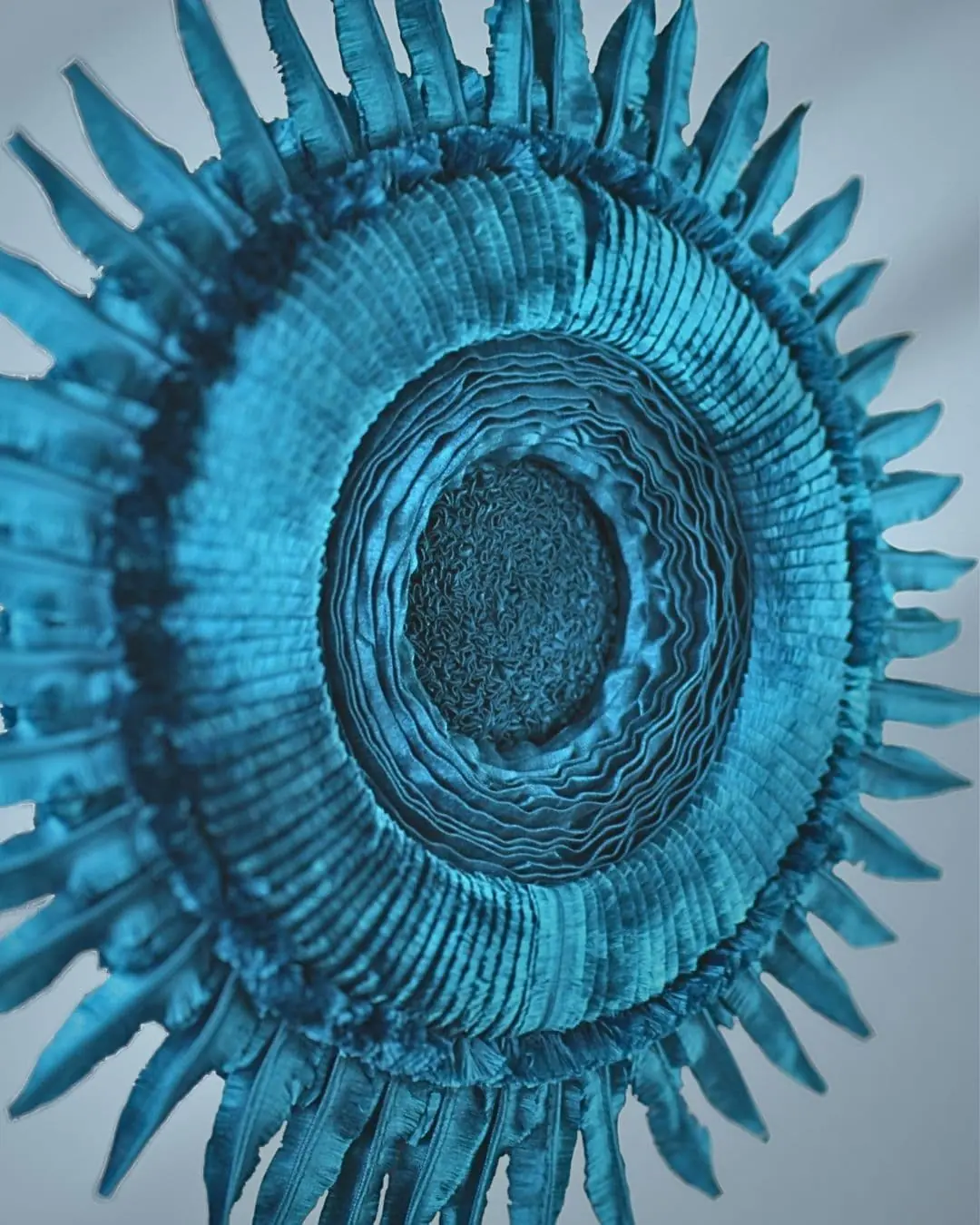 Textured blue circular textile wall art