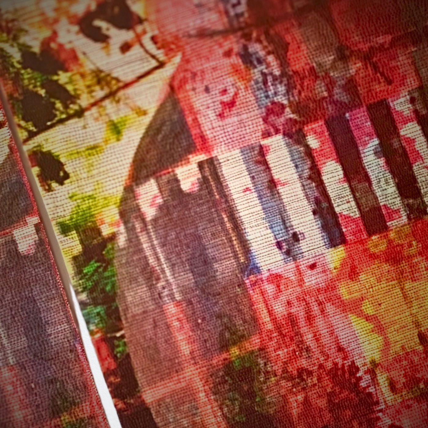 Vibrant red pottery with textured background.