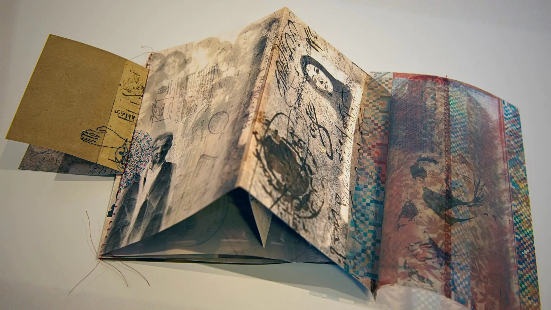 Artistic book with layered, textured pages.