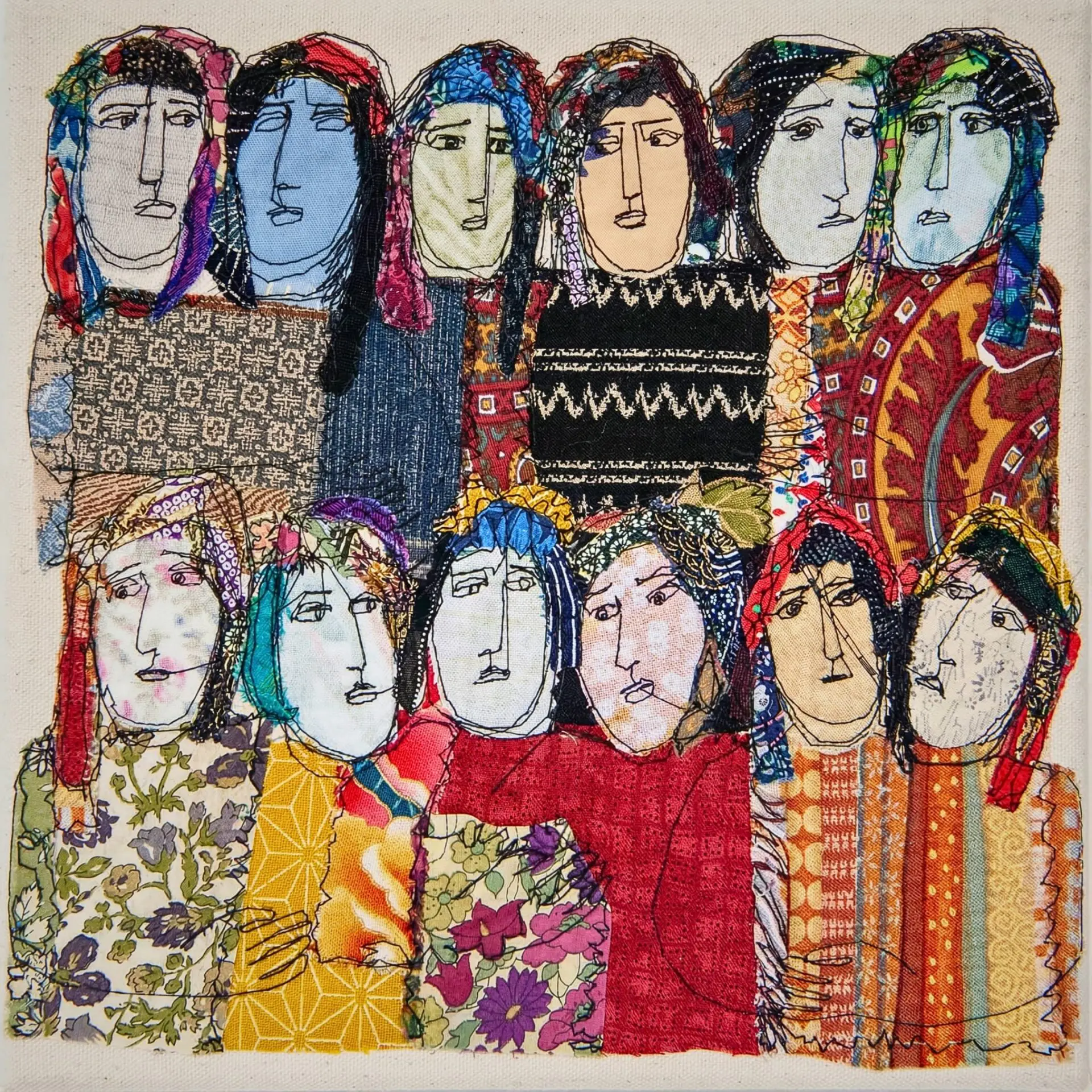 Colourful textile artwork of diverse faces.