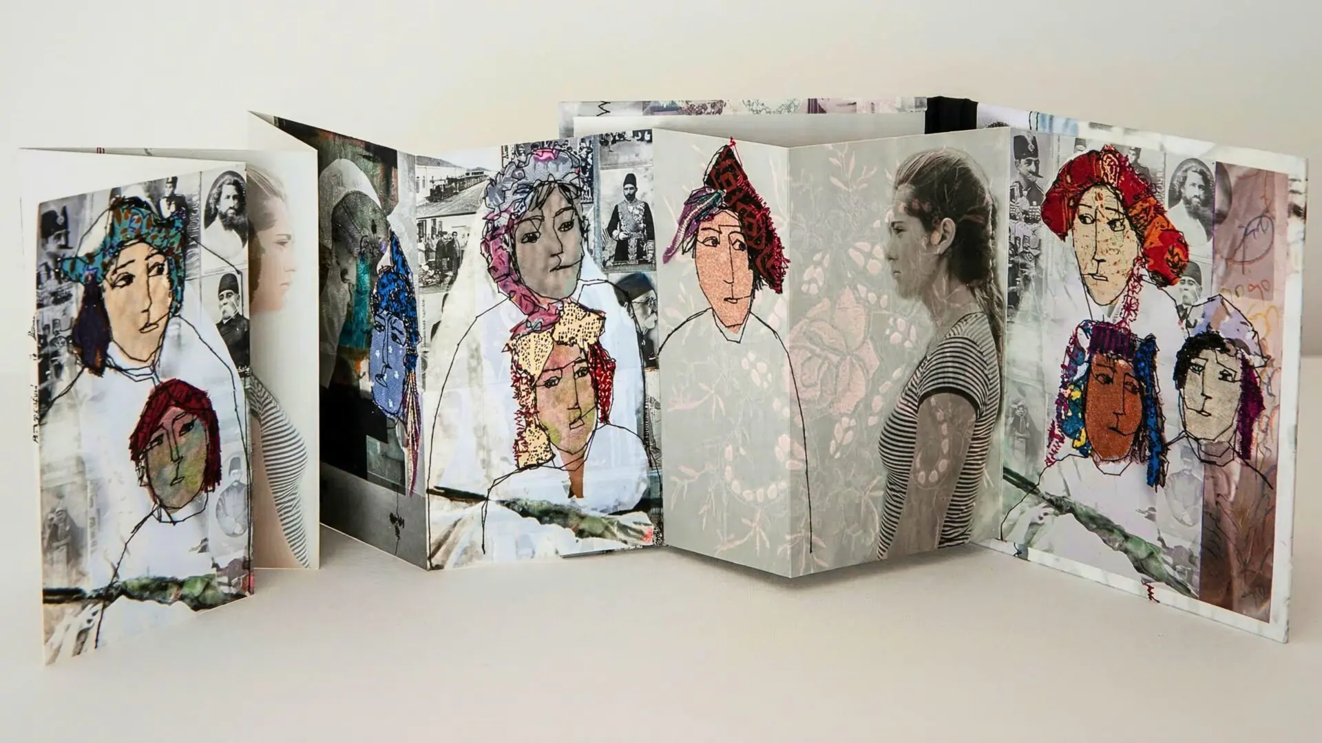Artistic collage of embroidered portraits in a concertina booklet