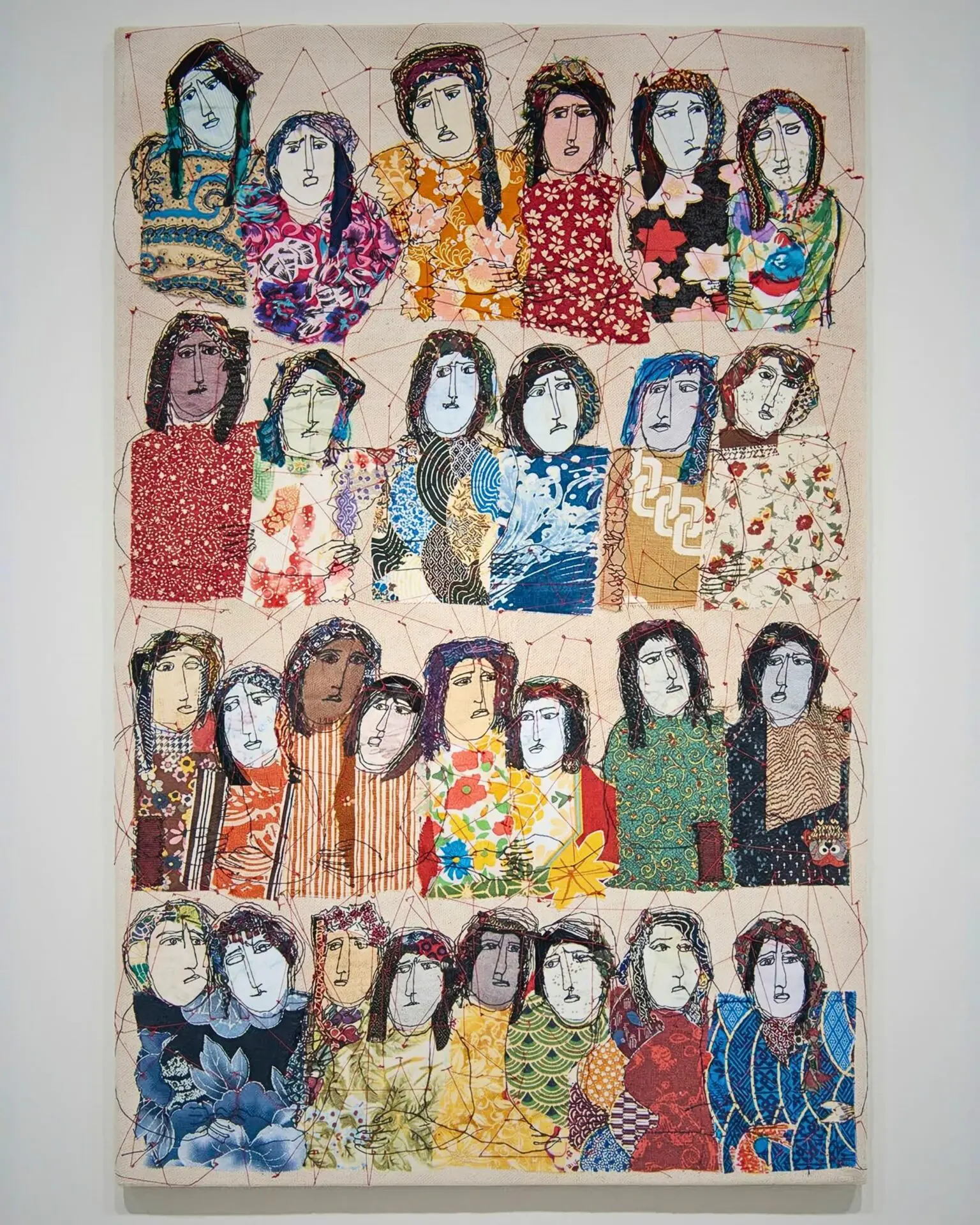 Colourful textile artwork of diverse women.