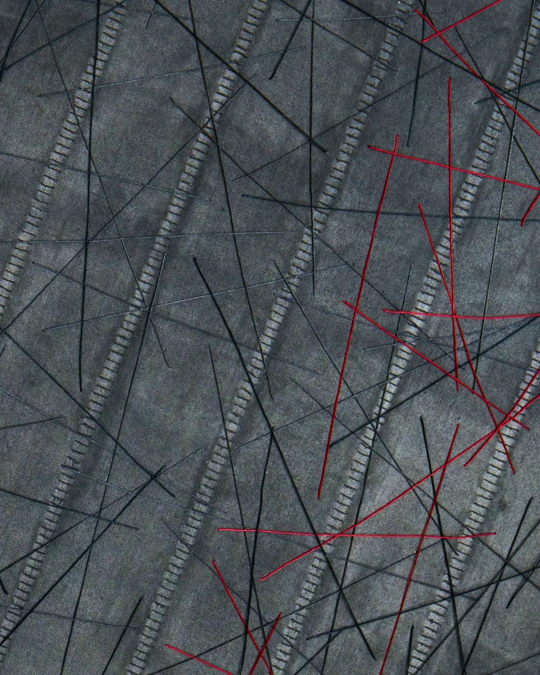 a close up of a stitched fabric artwork 