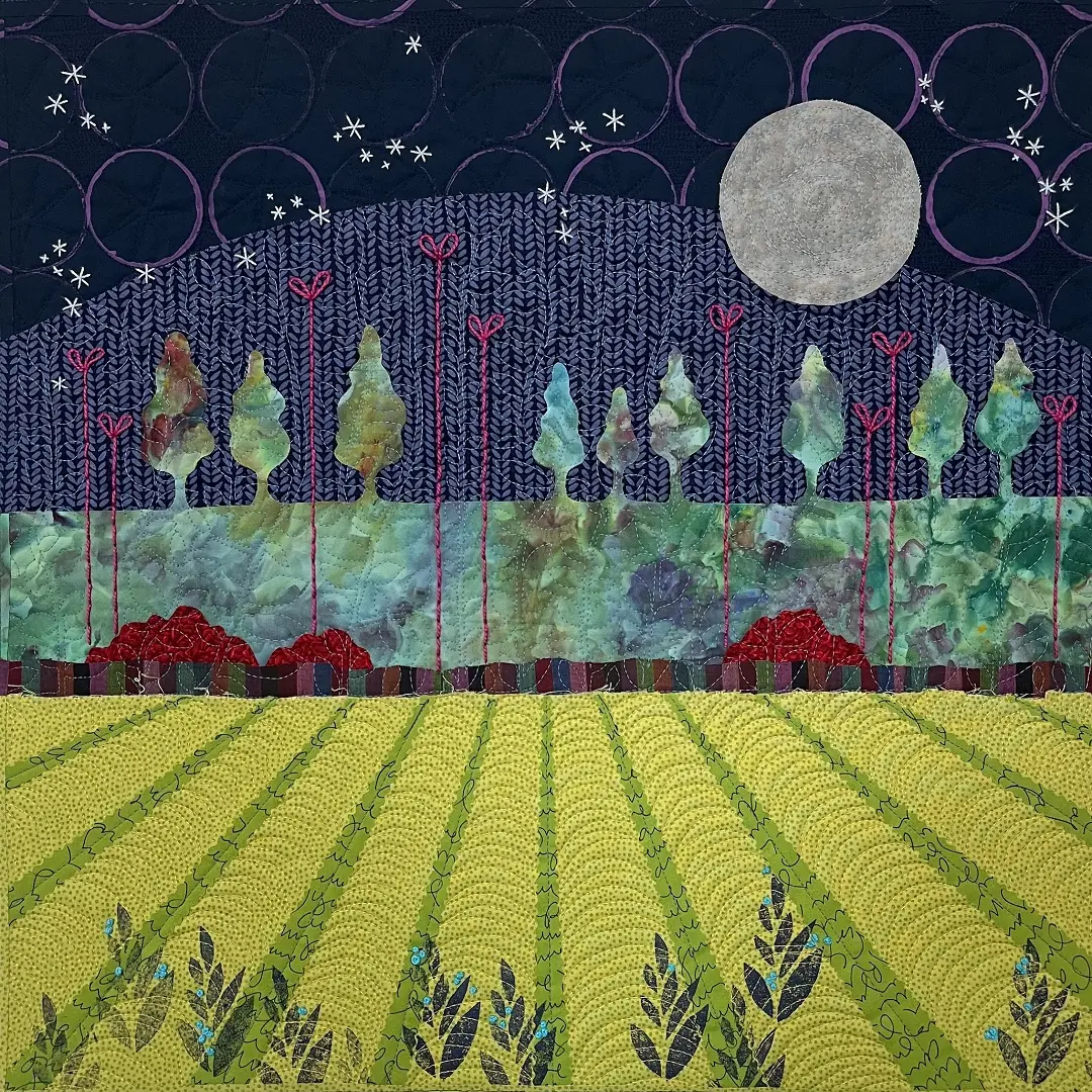 Abstract textile art piece with green field leading to trees and a moon in the sky