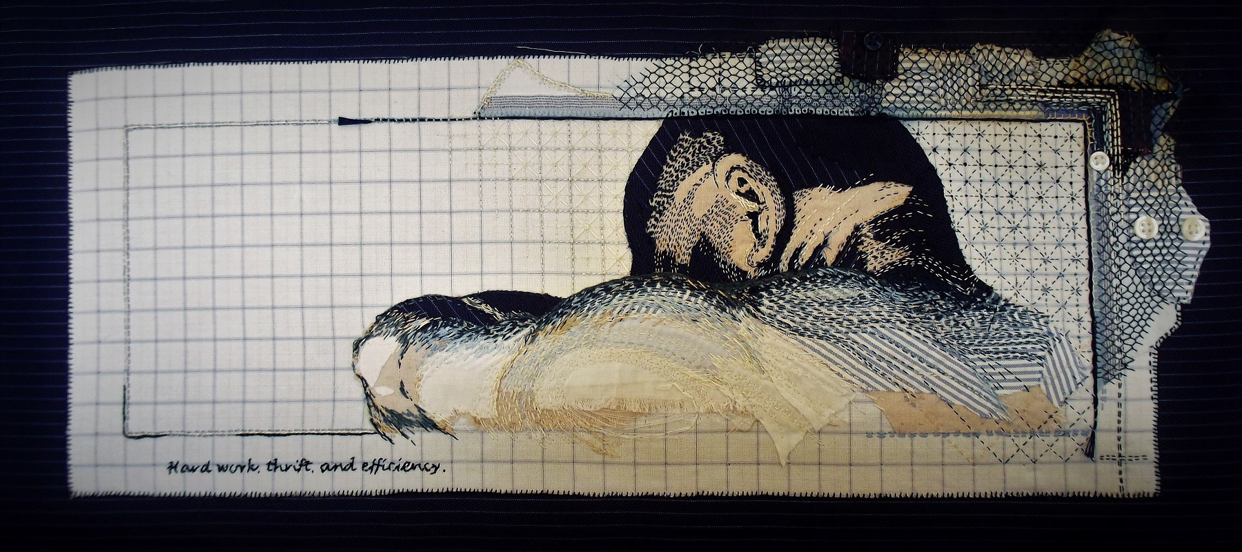 A piece of textile art on a piece of paper