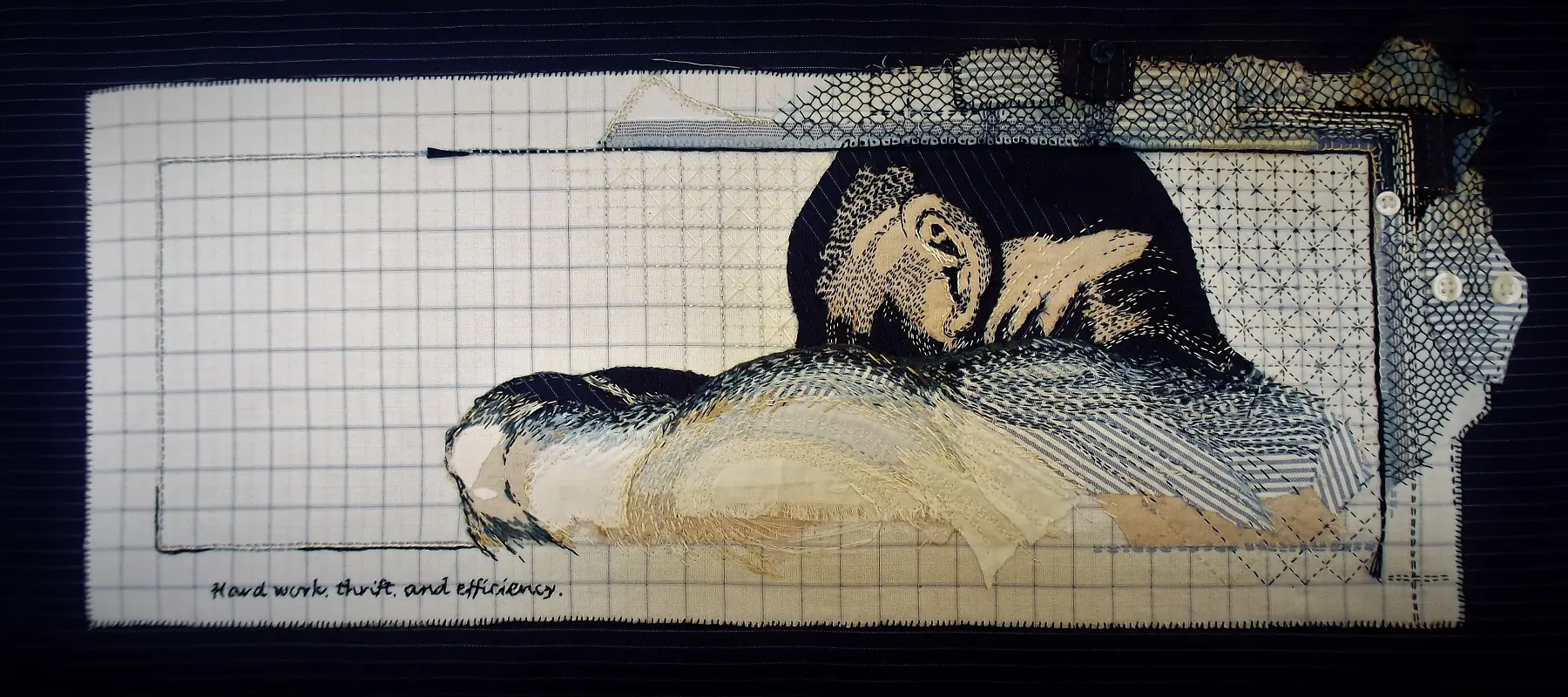 A piece of textile art on a piece of paper